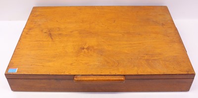 Lot 1153 - A wooden chest containing a quantity of 1950s...