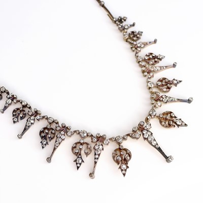 Lot A late Victorian yellow and white metal...