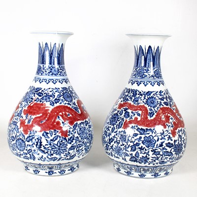 Lot 1 - A pair of Chinese porcelain baluster vases,...