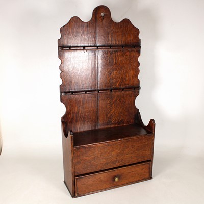 Lot 5 - A Welsh oak spoon rack, the shaped board with...