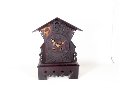 Lot 41 - An early 20th century Swiss stained softwood...
