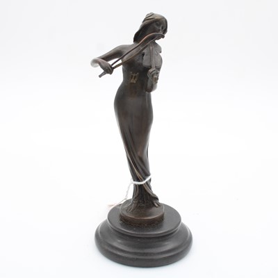 Lot 84 - A reproduction bronzed metal figure of a lady,...