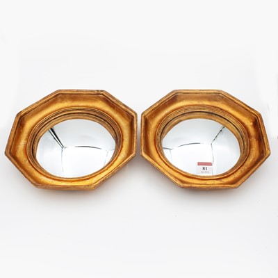 Lot 81 - A pair of reproduction convex wall mirrors,...