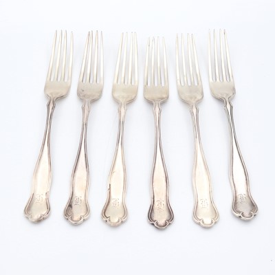 Lot 91 - A set of six George V silver table forks, in a...