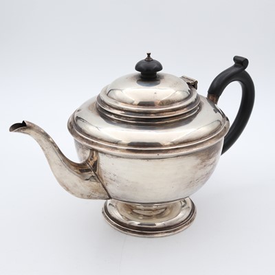 Lot 86 - A George V silver pedestal teapot, of circular...