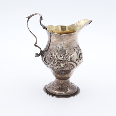 Lot 54 - A George III silver pedestal cream jug, of...