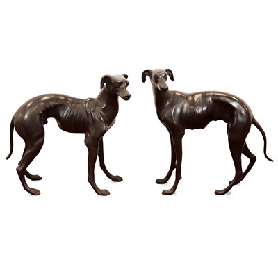 Lot 144 - A pair of lifesize bronze lurchers, each in...