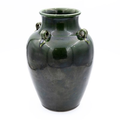 Lot 3 - An early 20th century green glazed pottery...