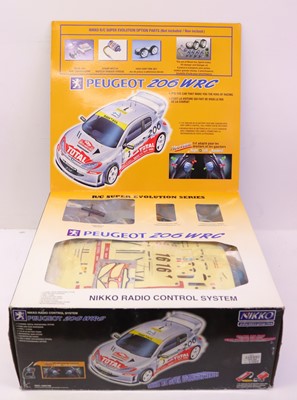 Lot 369 - Nikko Remote Control Peugeot 206 WRC car in...
