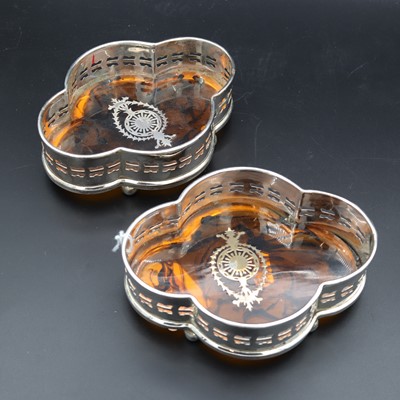 Lot 17 - A pair of reproduction silver-plated bottle...