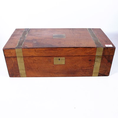 Lot 48 - A Victorian walnut and brass bound writing...