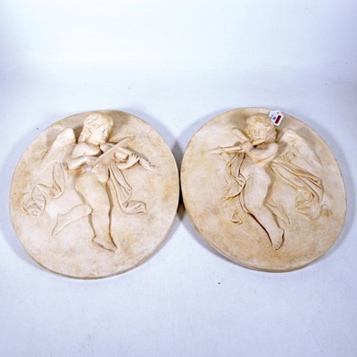 Lot 50 - A pair of plaster wall plaques, each relief...