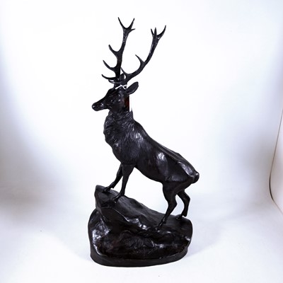 Lot 64 - A reproduction bronzed metal figure of a stag,...