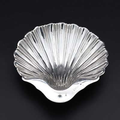 Lot 272 - A silver shell-shaped serving dish, standing...