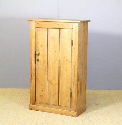 Lot 604 - A rustic pine low single door side cupboard,...