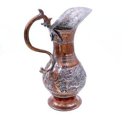 Lot 3 - A middle eastern tinned copper ewer, having a...
