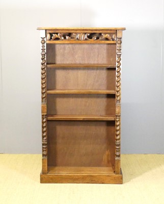 Lot 605 - An oak freestanding open bookshelf, having...