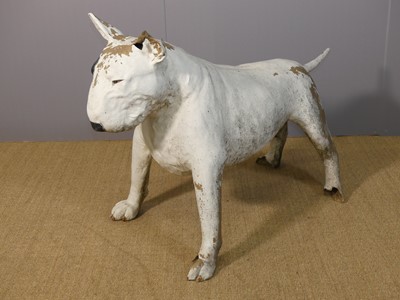Lot 607 - A painted fibreglass model of a standing bull...