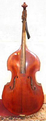 Lot 611 - A stained wood double bass, with printed...