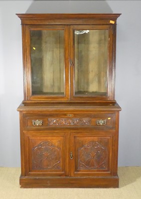 Lot 612 - An Edwardian floral relief carved walnut...