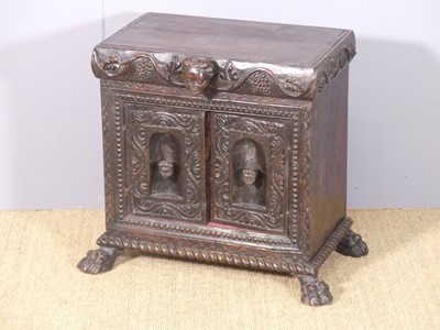 Lot 625 - A continental stained carved oak and walnut...