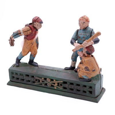 Lot 24 - A vintage cast iron mechanical money bank...