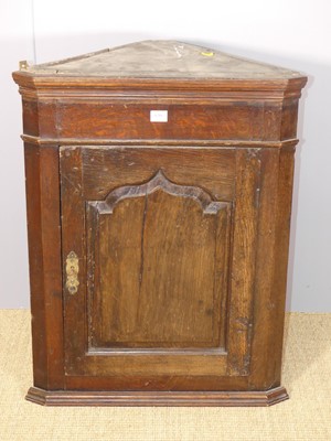 Lot 630 - An antique joined oak single door hanging...