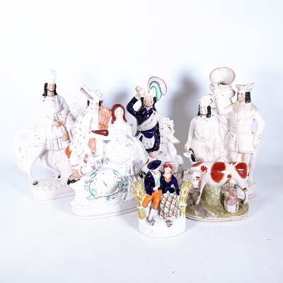 Lot 27 - A group of six Staffordshire pottery figures,...
