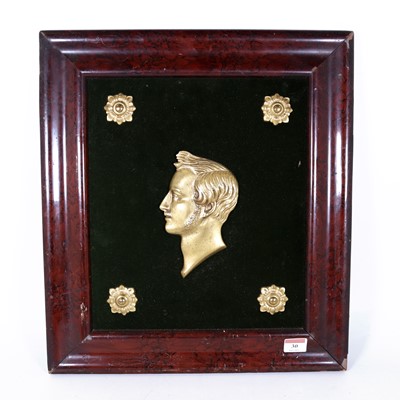 Lot 30 - A Victorian gilt metal relief portrait of...