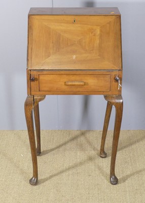 Lot 642 - A 1930s walnut lady's slopefront writing...