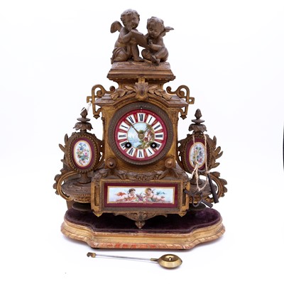 Lot 34 - A late 19th century French gilt metal mantel...