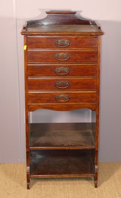 Lot 650 - An Edwardian walnut music chest, having five...