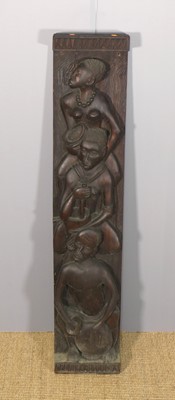 Lot 651 - A tribal relief carved hardwood narrow wall...