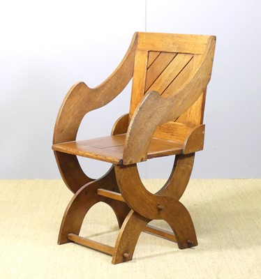 Lot 671 - An early 20th century oak panelled back and...