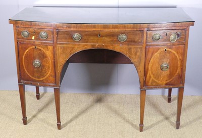 Lot 686 - A 19th century mahogany bowfront kneehole...