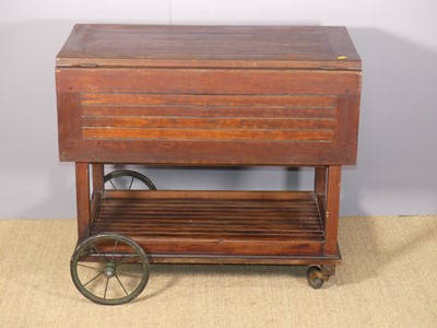 Lot 689 - A joined stained and slatted teak three-tier...