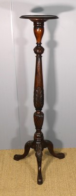 Lot 690 - A floral relief carved mahogany torchere stand,...
