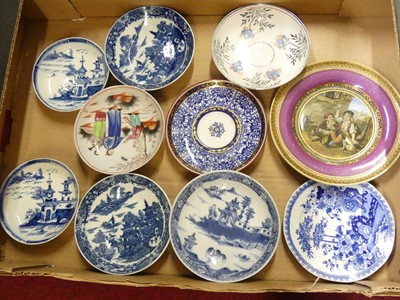 Lot 182 - A collection of porcelain saucers, to include...