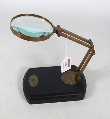 Lot 95 - A reproduction table top magnifying glass