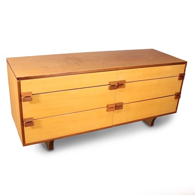 Lot 484 - A 1960s blond birch ply veneered low sideboard,...