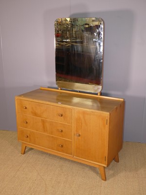 Lot 693 - A 1960s Meredew blond oak dressing chest,...