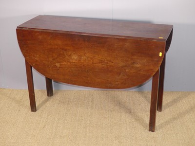 Lot 707 - An early 19th century drop leaf dining table,...