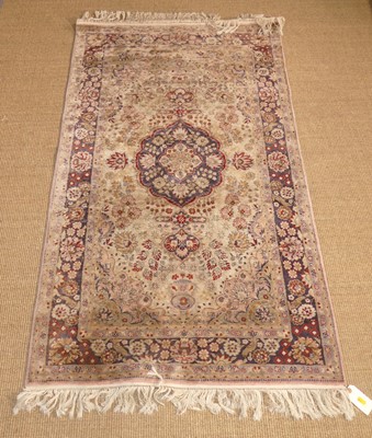 Lot 719 - A Persian woollen red, blue and pale ground...