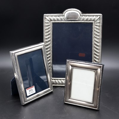 Lot 212 - A modern silver-clad easel photograph frame,...