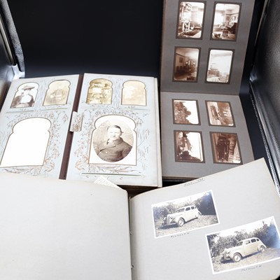 Lot 215 - An early 20th century photograph album, with...