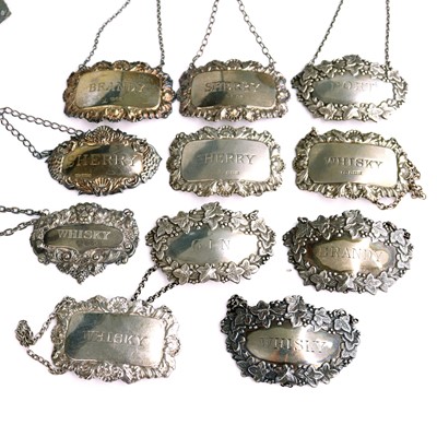 Lot 276 - A collection of silver decanter collars,...