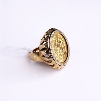 Lot 285 - A 9ct gold half sovereign set ring, the half...