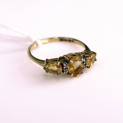 Lot 288 - A modern 9ct gold yellow topaz and diamond...