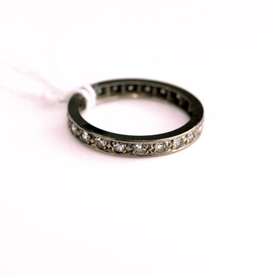 Lot 290 - A white metal diamond eternity ring, total...