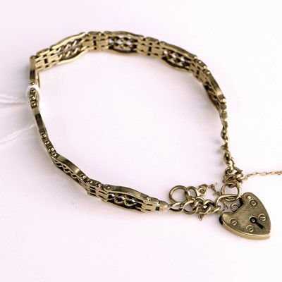 Lot 298 - A 9ct gold gatelink bracelet having heart...